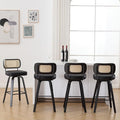 Bekrvio Swivel Bar Height Stools Set of 4, Upholstered Faux Leather Barstools with Rattan Back, 29" Seat Height Tall Bar Stools for Kitchen Counter, Black Wood Frame, Black